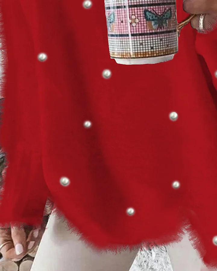 Volný svetr s výstřihem do V , dlouhým rukávem a korálky, zdobený ozdobou